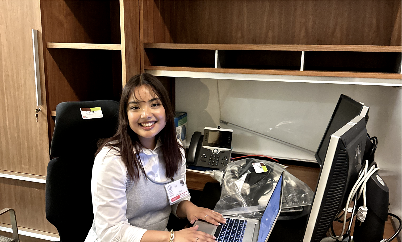 Victoria sitting at SEC work desk.